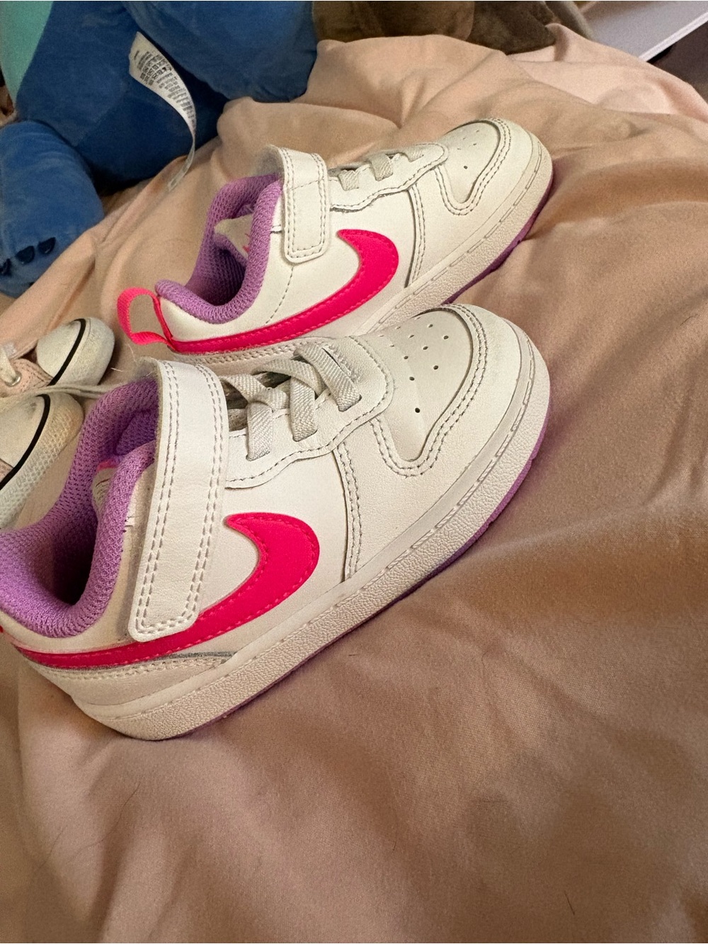 Nike Kids White Sneakers with Pink Swoosh and Purple Lining